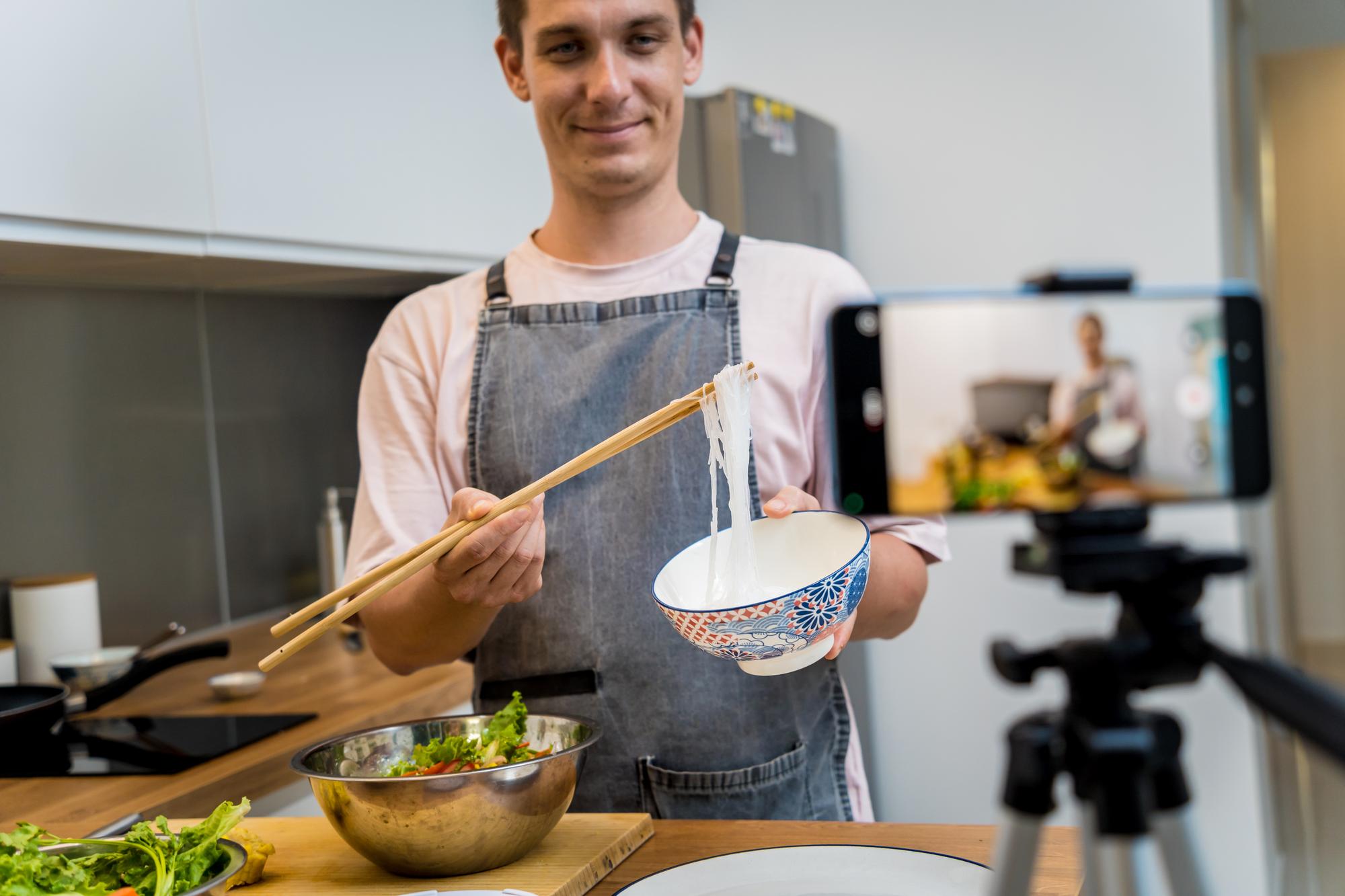Instructor explaining plating technique in modern kitchen
